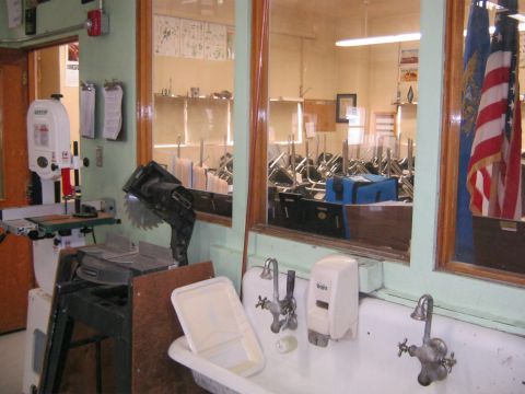 1994 Ford Bronco - Workshop scene with tools and a classroom visible through a window.