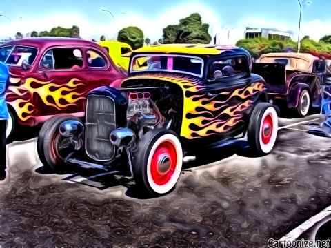 1990 Ford Bronco - A line of custom cars, including a hot rod with flame decals, are parked together on a sunny day.