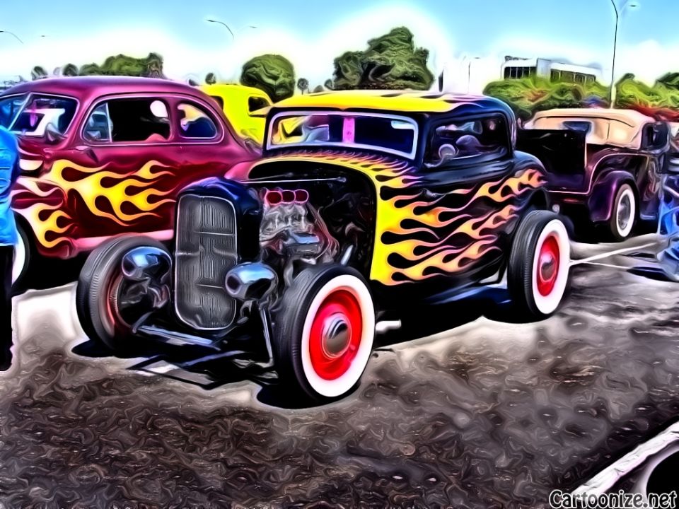 Hot rod with flame decals and exposed engine, parked next to a red car with flames and a tan convertible