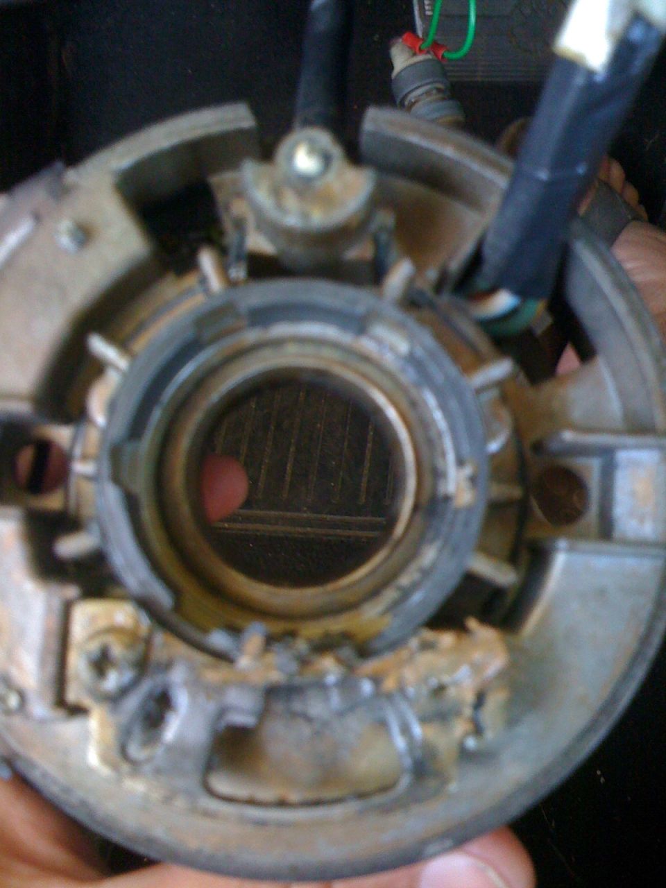 Steering column ignition switch housing with visible wiring and internal mechanism