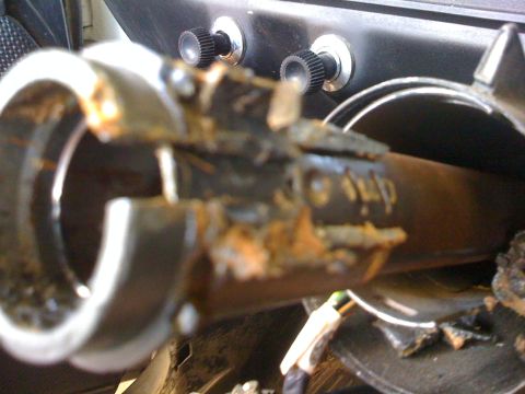 1964 Ford Ranchero - Rusted and broken steering column part, likely from an older vehicle.