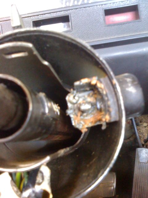1964 Ford Ranchero - The interior of a vehicle shows a broken steering column mechanism, suggesting a mechanical failure.