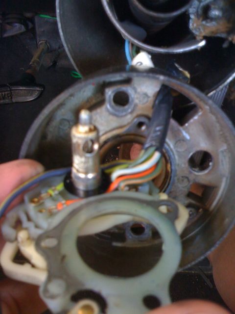 1964 Ford Ranchero - Close-up of a vehicle's steering column assembly, showing internal wiring and mechanical parts.