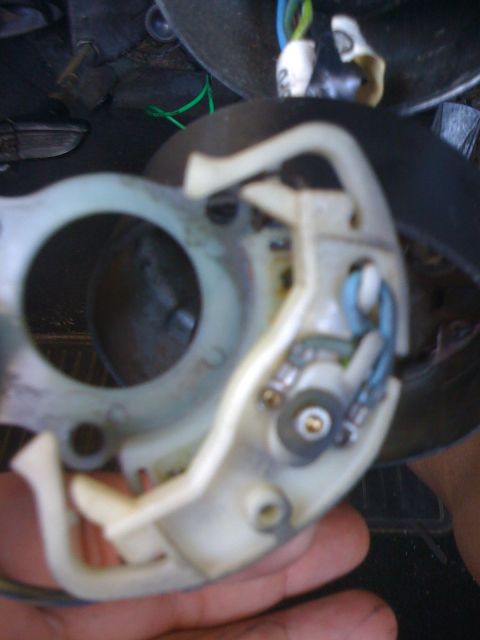 1964 Ford Ranchero - A broken steering column shifter mechanism is shown, with visible wires and electrical components.
