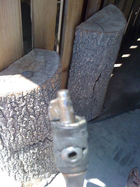 1964 Ford Ranchero - A close-up view of a damaged metal shifter lever, suggesting a mechanical failure.