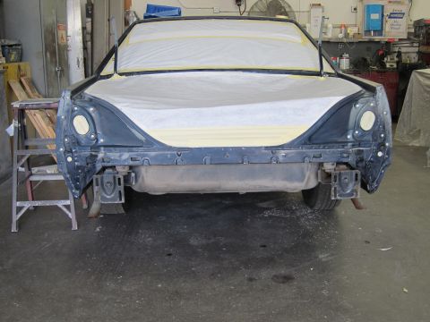 1991 Ford LTD Crown Victoria - The rear of a 1991 Ford Crown Victoria LTD is prepped for painting in a repair shop.