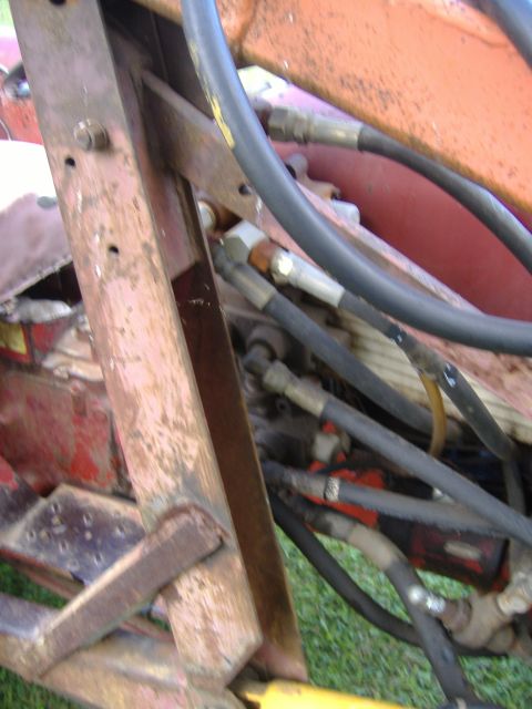 1988 Ford Bronco - Detail of hydraulic lines and structural components on what appears to be farm machinery, not a 1988 Ford Bronco.