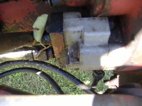 1988 Ford Bronco - Close-up view of a hydraulic valve assembly, likely from agricultural or heavy machinery.