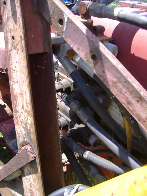 1988 Ford Bronco - Hydraulic system components on farm equipment, not a 1988 Ford Bronco.