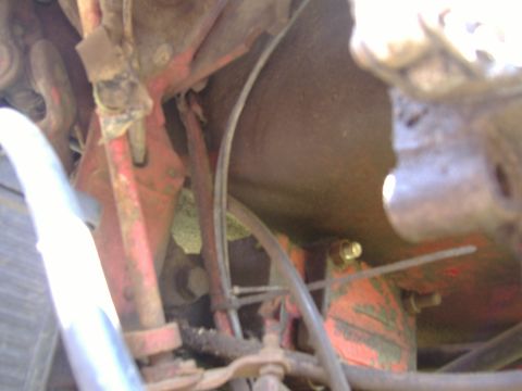 1988 Ford Bronco - Undercarriage view showing various mechanical components and hoses, with a SuperMotors watermark.