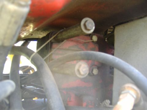 1988 Ford Bronco - Engine hoses and metal parts are visible in this close-up view.