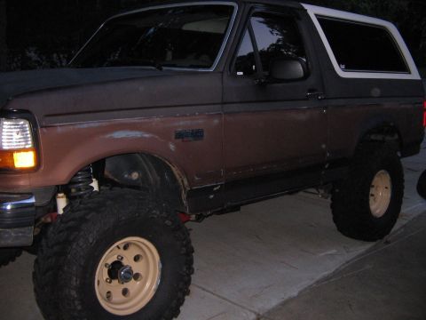1992 Ford Bronco - This lifted 1992 Ford Bronco has large off-road tires and a two-tone paint scheme.