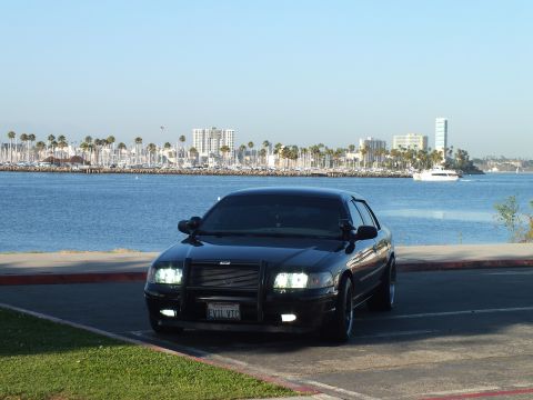 2003 Ford Crown Victoria - Murdered-out sedan with EVIL VIC plate stares down the marina with lights blazing