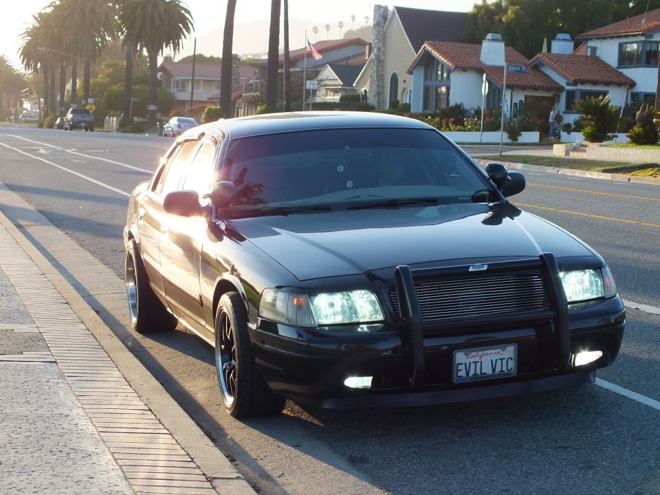 Black Ford Crown Victoria front quarter with mesh grille and EVIL VIC plate