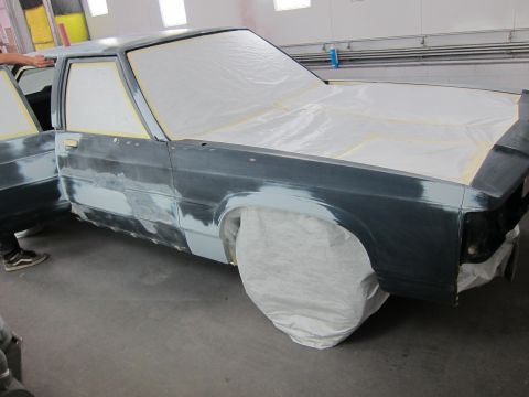 1991 Ford LTD Crown Victoria - Car body undergoing repairs and preparation for paint in a body shop.