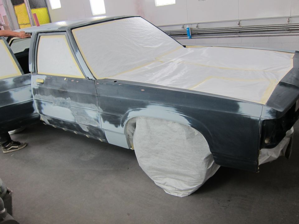 1991 Ford Crown Victoria LTD bodywork in progress, doors open, covered in primer and masking tape