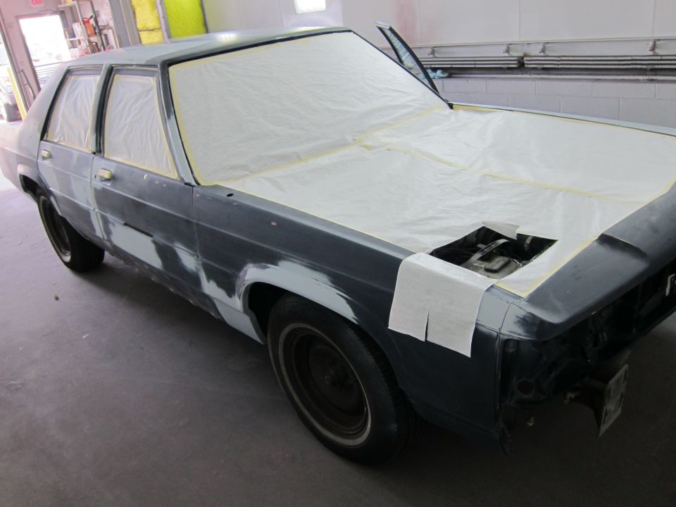 1991 Ford Crown Victoria LTD in primer, masked for paint. Hood and fenders are covered