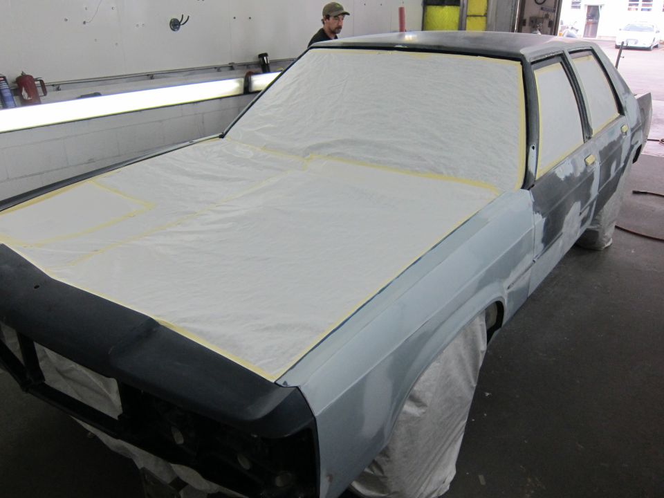 1991 Ford Crown Victoria LTD being prepped for paint, hood and windows covered