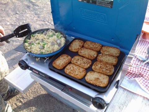 1985 Toyota 4Runner - Cooking breakfast on a portable camping stove with hash browns and eggs.