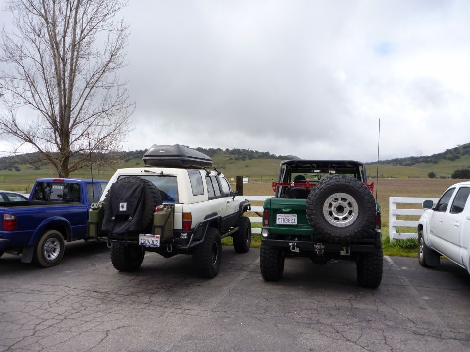 White 1985 Toyota 4Runner with roof box and spare tire on rear