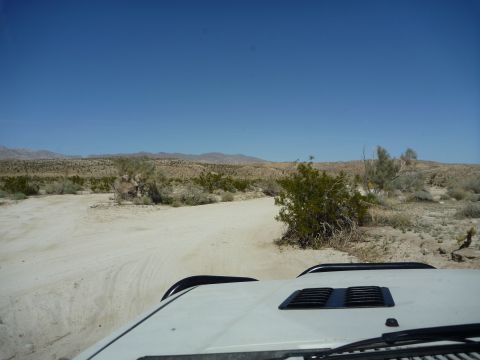 1985 Toyota 4Runner - Driving through a dry, arid landscape under a clear blue sky.