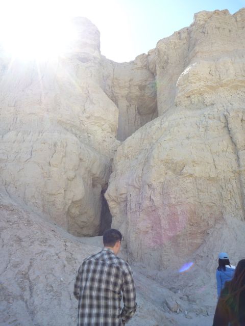 1985 Toyota 4Runner - Sunlight streams into a desert canyon, illuminating the textured rock formations.