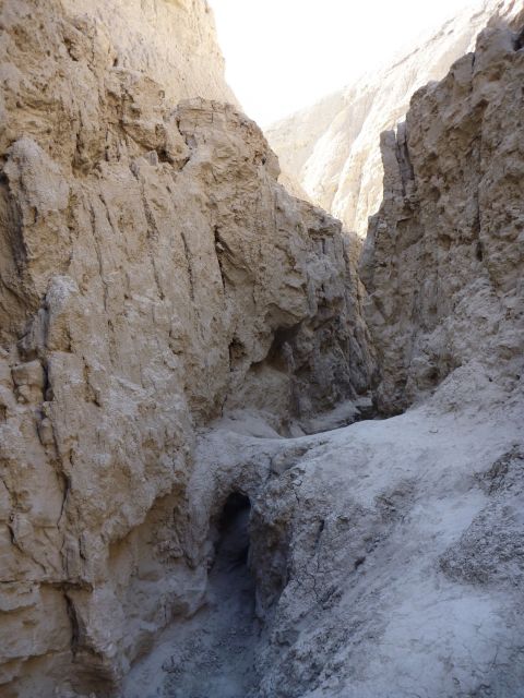 1985 Toyota 4Runner - A narrow desert canyon with towering rock walls and a path leading into the distance.