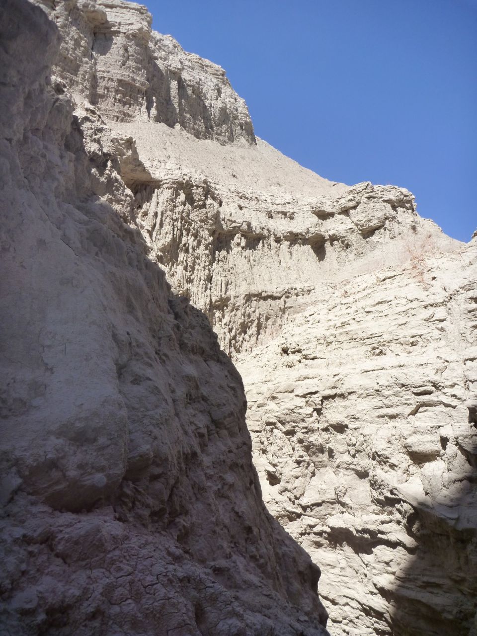 rock canyon walls under a clear blue sky