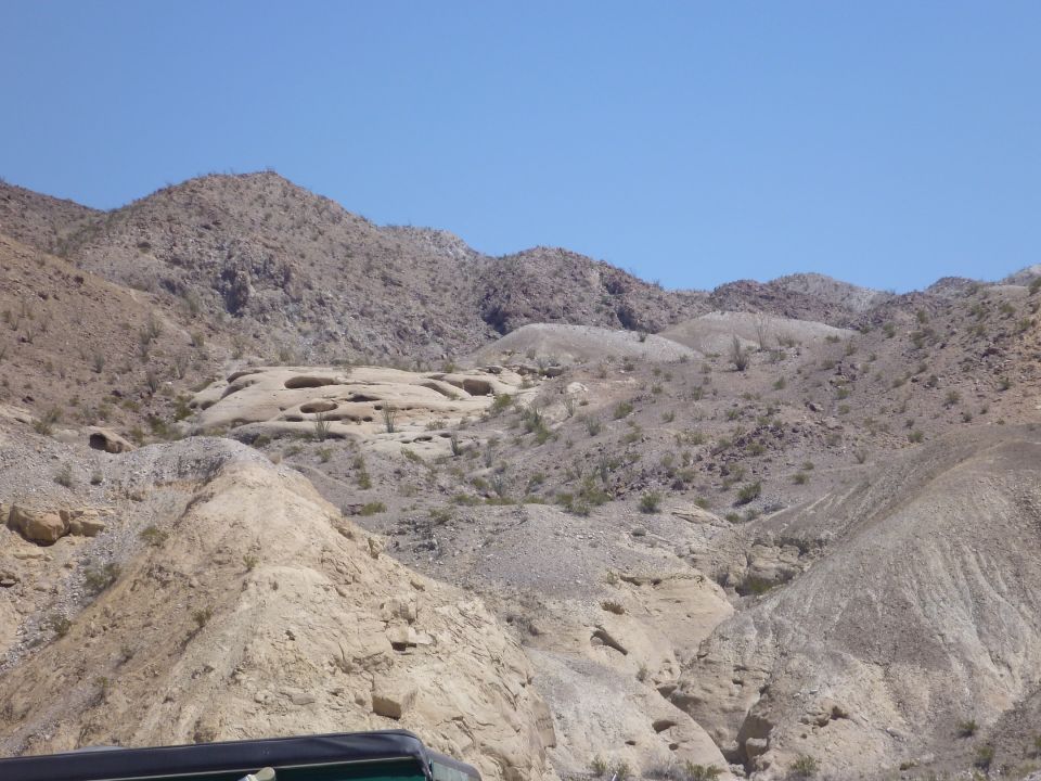Desert mountains with rocky terrain under a clear blue sky