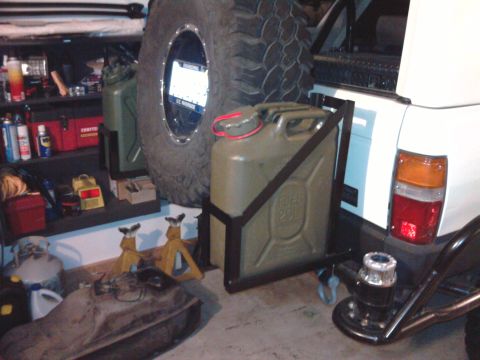 1985 Toyota 4Runner - Rear view of a white Toyota 4Runner with a spare tire and jerry can mounted.