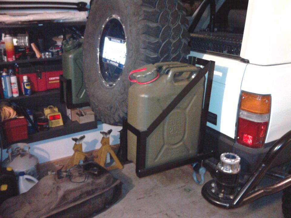 White Toyota 4Runner rear with spare tire, jerry can, and aftermarket bumper