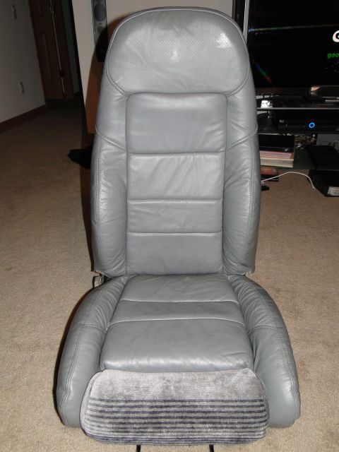 1978 Ford Bronco - A single gray leather car seat is shown indoors, with a website watermark at the bottom.