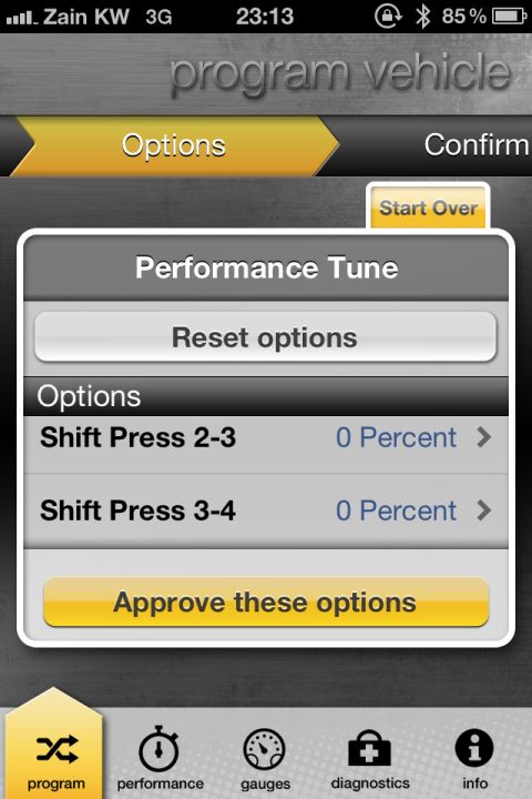 2001 Mercury Grand Marquis - A phone screen displays a performance tuning application interface, showing options to adjust shift press percentages.