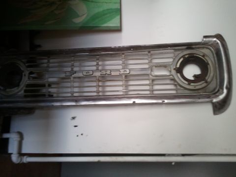 1993 Ford Bronco - A close-up view of a vintage Ford grille, the embossed 'FORD' lettering.