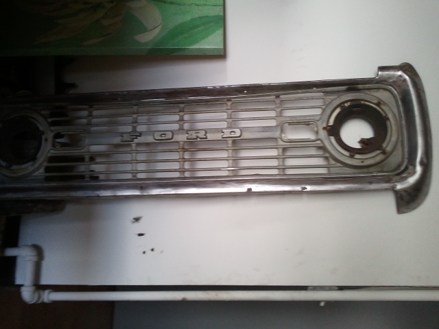 Ford grille with chrome trim and horizontal bars