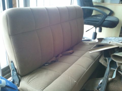 1993 Ford Bronco - The photo shows a bench seat from a vehicle's interior, not the exterior.
