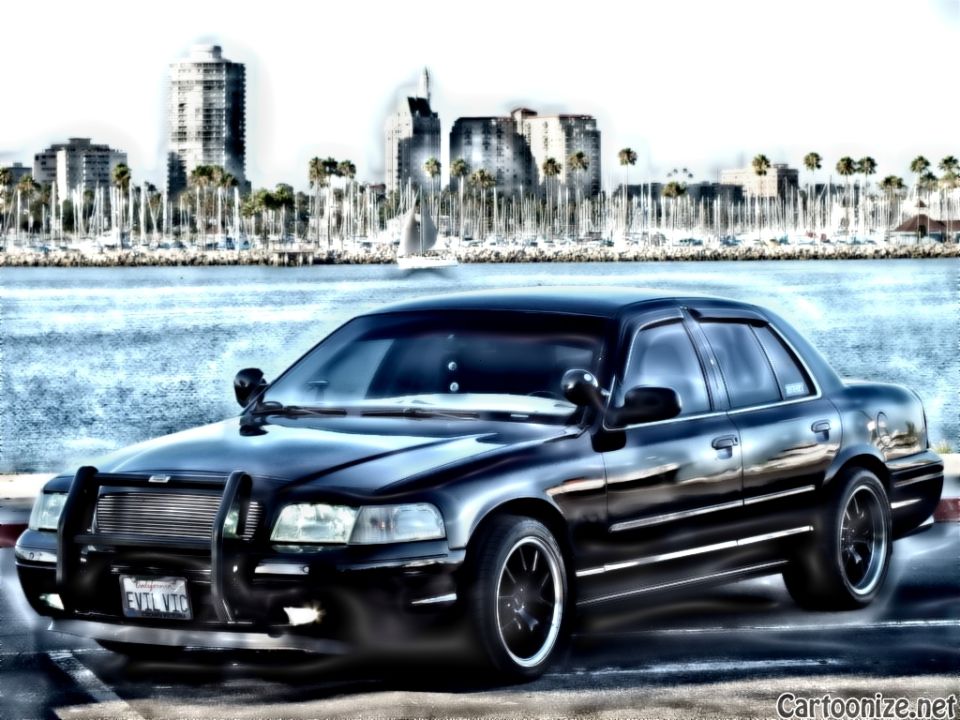 Black Crown Victoria front three-quarter beside marina with sailboats, push bar and EVIL VIC plate, filtered