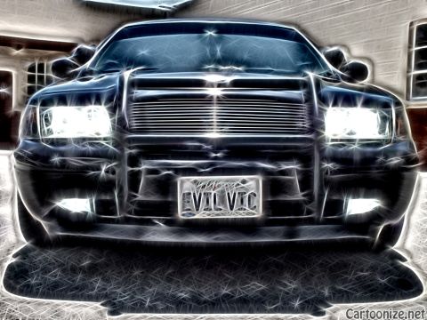 2003 Ford Crown Victoria - Front-on neon-traced edit of a black Panther sedan; billet grille and vanity plate reading EVIL VIC.
