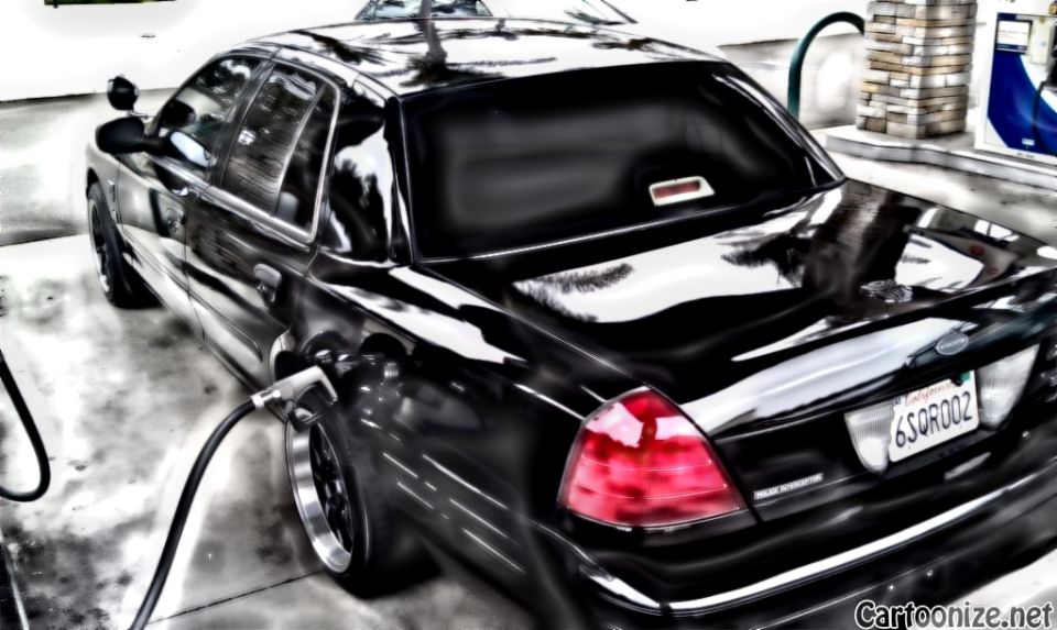 Black Crown Victoria rear three-quarter at gas station with fuel nozzle, plate 6SOROOZ, stylized filter