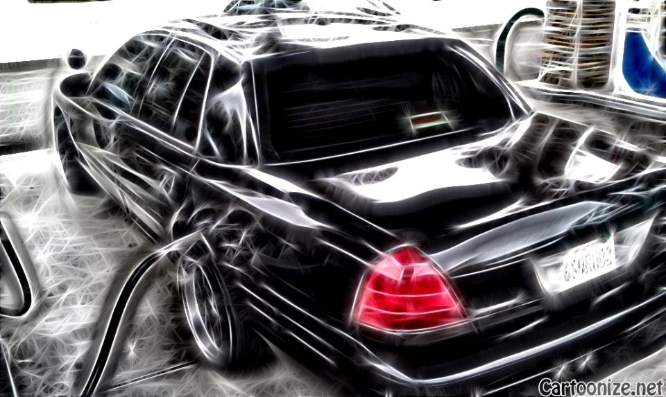 Black sedan rear three-quarter at gas station rendered with glowing neon edge-trace filter, lit taillight