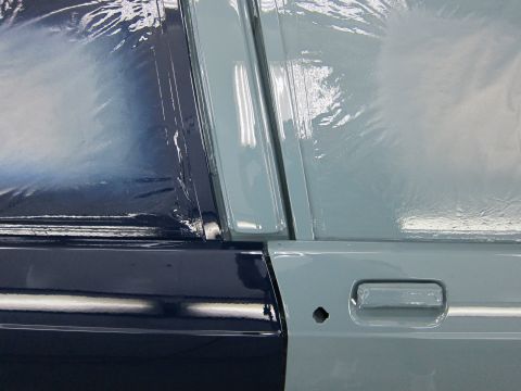 1991 Ford LTD Crown Victoria - Car door detail with paint protection film applied over fresh paint.