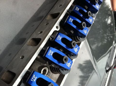 1991 Ford F-250 - Engine cylinder head with blue roller rockers, part number 1.72F visible.