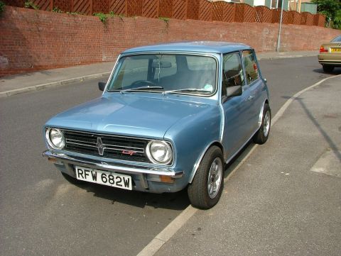 1980 MINI Cooper - This 1980 Mini Cooper is parked curbside on a sunny day.