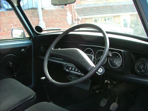 1980 MINI Cooper - Interior view of a 1980 MINI Cooper, highlighting the dashboard and driver's seat.
