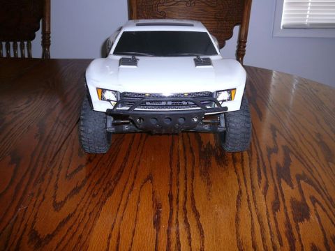 1988 Ford Bronco - This is a remote-controlled truck, not a 1988 Ford Bronco, with a prominent front bumper and off-road tires.
