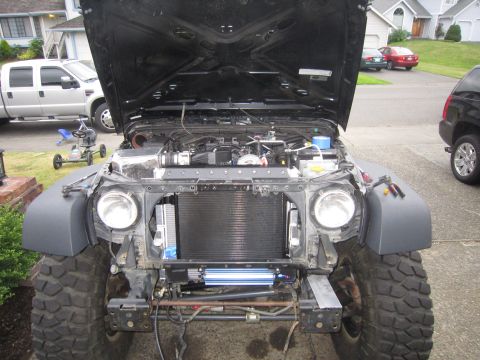 2008 Jeep Wrangler - Jeep Wrangler front view with hood open, revealing the engine and radiator assembly.