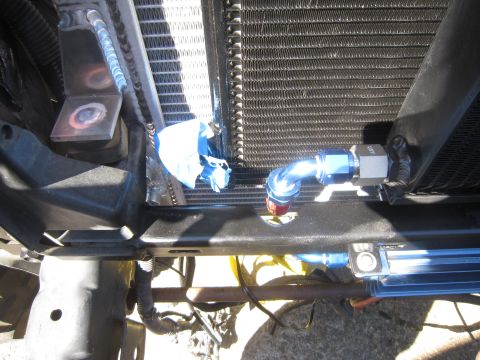 2008 Jeep Wrangler - Custom engine oil cooler lines and radiator fittings visible in engine bay.