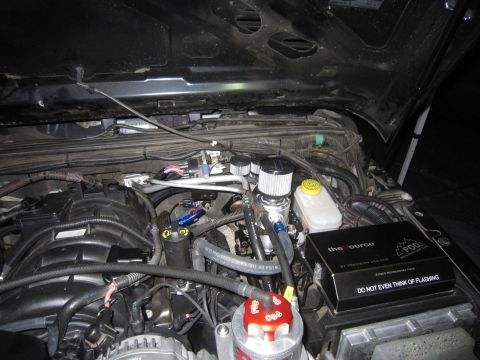 2008 Jeep Wrangler - Custom engine modifications are visible in this engine bay, including oil catch cans and a "POD" device.