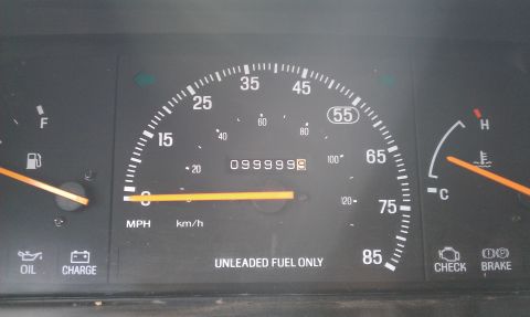 1991 Ford Festiva - Dashboard gauges including speedometer, fuel, and temperature. Odometer reads 0999999.