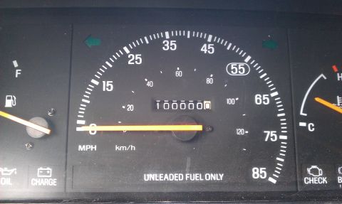 1991 Ford Festiva - The dashboard displays the vehicle's mileage and fuel level, with the speedometer needle at zero.
